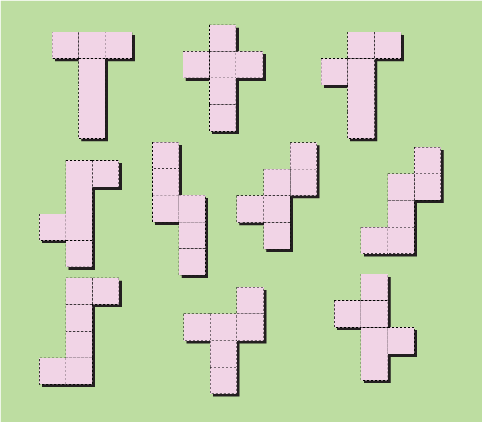 Pink T-shaped tiles scattered across a green field, all the same shape and size.